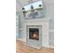 Close up of a fireplace with a modern mantle and marble hearth at 32 Monte Sano Dr, Hanahan, SC 29410