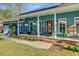 A cozy front porch with rocking chairs and hanging plants welcomes visitors at 32 Monte Sano Dr, Hanahan, SC 29410
