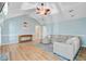 Inviting living room with vaulted ceiling, wood floors, and comfortable sectional sofa at 32 Monte Sano Dr, Hanahan, SC 29410