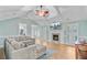 Cozy living room with fireplace, TV, vaulted ceiling, and comfortable seating at 32 Monte Sano Dr, Hanahan, SC 29410