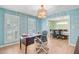 Bright office space with hardwood floors, desk, shuttered windows, and elegant light fixture at 32 Monte Sano Dr, Hanahan, SC 29410