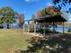 Outdoor picnic shelter with tables overlooking the lake and a tranquil setting at 32 Monte Sano Dr, Hanahan, SC 29410