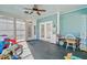 Spacious sunroom with tile floor and plenty of space for toys and activities with backyard access at 32 Monte Sano Dr, Hanahan, SC 29410