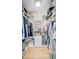 Custom walk-in closet equipped with custom shelves and ample storage for clothing and accessories at 32 Monte Sano Dr, Hanahan, SC 29410