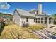 A spacious backyard features a well-maintained lawn, mature trees, patio, and a privacy fence, ideal for outdoor enjoyment at 3274 Heathland Way, Mount Pleasant, SC 29466