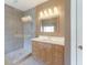 Stylish bathroom featuring a glass walk-in shower and a wooden vanity with ample storage at 3274 Heathland Way, Mount Pleasant, SC 29466