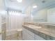 Cozy bathroom with a shower/tub combo and a tiled countertop with a sink at 3274 Heathland Way, Mount Pleasant, SC 29466