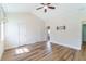 Bright bedroom with high ceilings, wood floors, and a wall mount for a TV at 3274 Heathland Way, Mount Pleasant, SC 29466