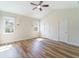 Bright bedroom featuring wood floors, two windows, and neutral paint at 3274 Heathland Way, Mount Pleasant, SC 29466