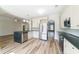 Bright, open kitchen with stainless steel appliances, granite countertops, and an island with ample counter space at 3274 Heathland Way, Mount Pleasant, SC 29466