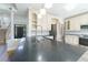 A modern kitchen features granite countertops, stainless steel appliances, and custom cabinetry with convenient access to entry at 3274 Heathland Way, Mount Pleasant, SC 29466