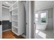 Bathroom leading to the closet showcasing the large soaking tub and window views at 35 Cypress St, Charleston, SC 29403