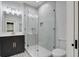 A bathroom featuring a glass walk-in shower and vanity with modern fixtures and hardware at 35 Cypress St, Charleston, SC 29403