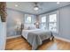 Sun-filled bedroom features hardwood floors, large windows, and recessed lighting at 35 Cypress St, Charleston, SC 29403