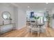Open-concept dining room leading to the kitchen, with modern furnishings and natural light at 35 Cypress St, Charleston, SC 29403