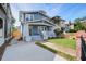 Charming two-story home with brick walkway, fresh lawn and inviting covered front porch at 35 Cypress St, Charleston, SC 29403