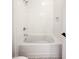 Clean white tiled bathtub with a shower and hexagon tile floor at 3853 Delinger Dr, Mount Pleasant, SC 29466