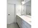 Bright bathroom featuring a white double vanity, gray hexagon tile flooring, and a large mirror at 3853 Delinger Dr, Mount Pleasant, SC 29466