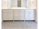 Bathroom vanity with double sinks, white cabinets, drawers, and hexagon tile floor at 3853 Delinger Dr, Mount Pleasant, SC 29466