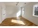 Bright and open bedroom featuring hardwood floors, two windows and a ceiling fan at 3853 Delinger Dr, Mount Pleasant, SC 29466