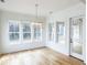 Bright dining area with large windows and a glass door leading to the deck at 3853 Delinger Dr, Mount Pleasant, SC 29466