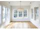 Bright dining room with large windows and a modern chandelier, perfect for entertaining at 3853 Delinger Dr, Mount Pleasant, SC 29466