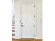 White door with black hardware stands beside stairs and hardwood floors at 3853 Delinger Dr, Mount Pleasant, SC 29466