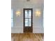 Welcoming entryway featuring a wooden door with sidelights and decorative wall sconces at 3853 Delinger Dr, Mount Pleasant, SC 29466