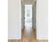 Hallway leads to bathroom with standalone tub and picture window at 3853 Delinger Dr, Mount Pleasant, SC 29466