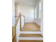 Second story hallway showcasing hardwood floors, white trim, and natural lighting at 3853 Delinger Dr, Mount Pleasant, SC 29466