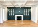 Cozy living room featuring built-in cabinets flanking a fireplace with views into the kitchen at 3853 Delinger Dr, Mount Pleasant, SC 29466