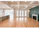 Open-concept living room with fireplace and coffered ceiling, flowing into the kitchen at 3853 Delinger Dr, Mount Pleasant, SC 29466