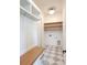 Charming mudroom with built-in bench, storage, shelving, and a unique tiled floor at 3853 Delinger Dr, Mount Pleasant, SC 29466