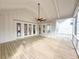 Covered porch featuring a ceiling fan and views of the surrounding neighborhood at 3853 Delinger Dr, Mount Pleasant, SC 29466