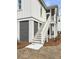 Exterior stairway leads to a screened-in porch with durable siding and convenient ground-level storage at 3853 Delinger Dr, Mount Pleasant, SC 29466