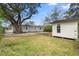 Backyard of a home with big trees and green grass at 422 Jean Wells Dr, Goose Creek, SC 29445