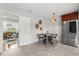 Cozy dining area features tiled floors and stainless-steel refrigerator at 422 Jean Wells Dr, Goose Creek, SC 29445