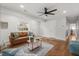 Bright living room features hardwood floors, ceiling fan, and a comfortable seating area at 422 Jean Wells Dr, Goose Creek, SC 29445