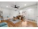 Bright living room features hardwood floors, ceiling fan, and a comfortable seating area at 422 Jean Wells Dr, Goose Creek, SC 29445