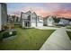 Stylish two-story home showcasing neutral siding, a two-car garage, and lush green landscaping at 436 Rowley Ln, Summerville, SC 29486