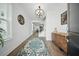 Elegant foyer featuring hardwood floors, a stylish rug, and a decorative chandelier at 436 Rowley Ln, Summerville, SC 29486