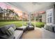 Covered patio featuring two couches, two chairs, ceiling fan, and great views of the lush green yard at 436 Rowley Ln, Summerville, SC 29486