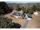 A bird's-eye view of the home, garage, and covered parking surrounded by trees at 6118 Hazelhurst Ln, Ravenel, SC 29470