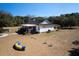 Aerial view of home's exterior including large yard and dog agility course at 6118 Hazelhurst Ln, Ravenel, SC 29470