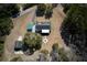 A top-down view showcasing the home, circular driveway, and treed property at 6118 Hazelhurst Ln, Ravenel, SC 29470
