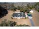 A high-angle view of the home, front lawn, and surrounding trees on the property at 6118 Hazelhurst Ln, Ravenel, SC 29470