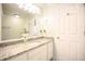 Bathroom with white cabinets, granite countertops, and a large mirror at 6118 Hazelhurst Ln, Ravenel, SC 29470