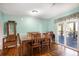 Cozy dining room with wood table set, next to sliding doors leading to an outdoor patio at 6118 Hazelhurst Ln, Ravenel, SC 29470