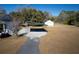 View of the driveway, covered parking, and garage on the property at 6118 Hazelhurst Ln, Ravenel, SC 29470