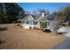 Exterior view of the home featuring a welcoming porch and attractive landscaping at 6118 Hazelhurst Ln, Ravenel, SC 29470